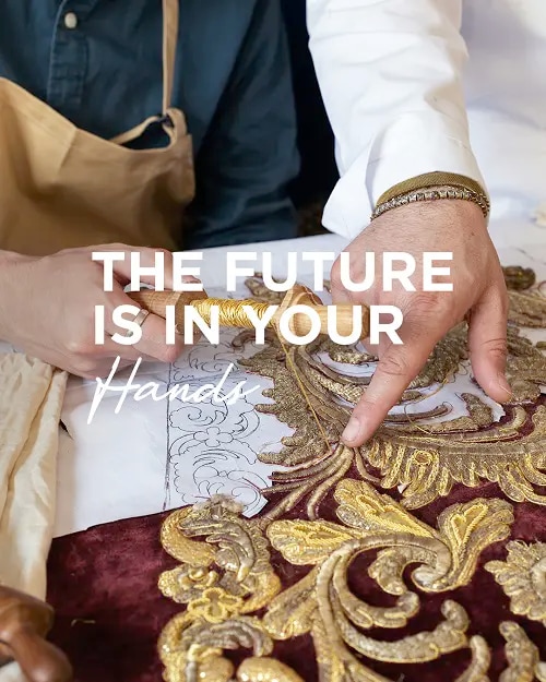 A person embroidering