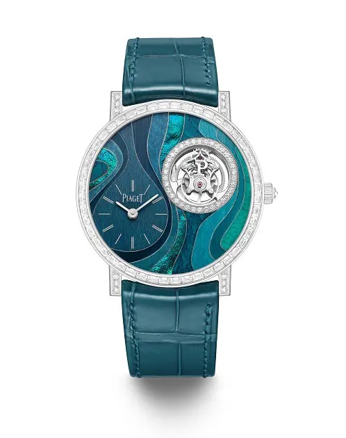 A watch encrusted with diamonds, with dark turquoise leather strap