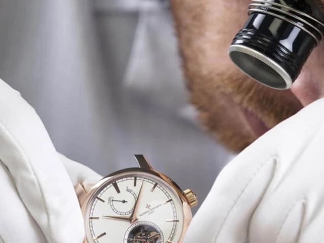 A man assembling a watch