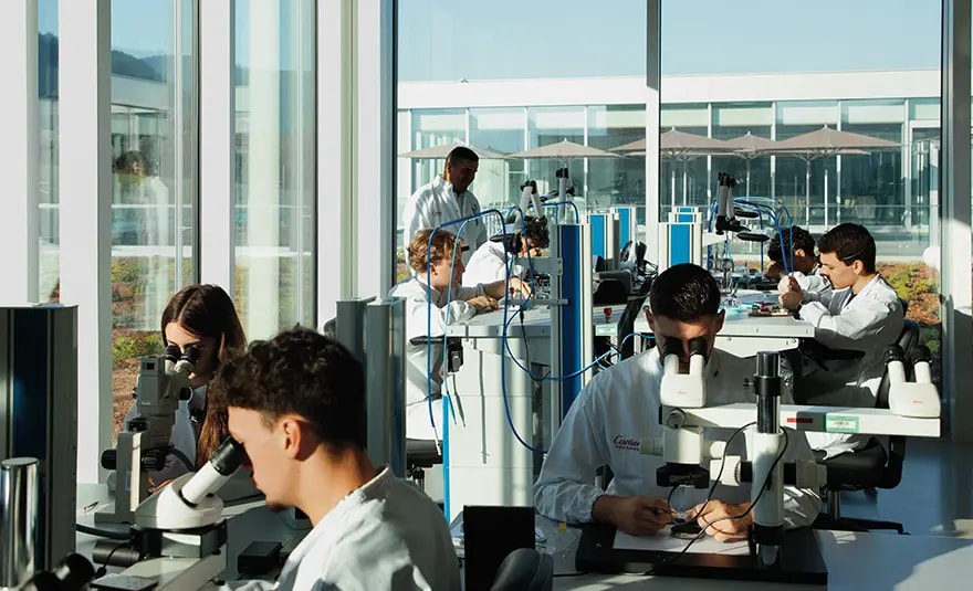 Group of students working in a lab at Cartier IHC campus