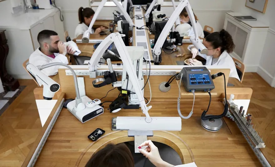 Photo of students boys and girls working on assembling gemstones 