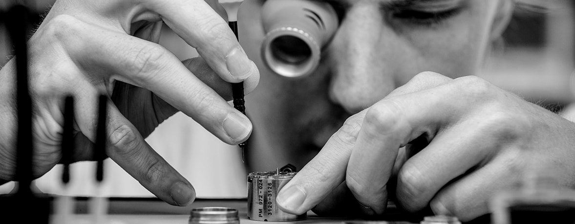 A man assembling a watch
