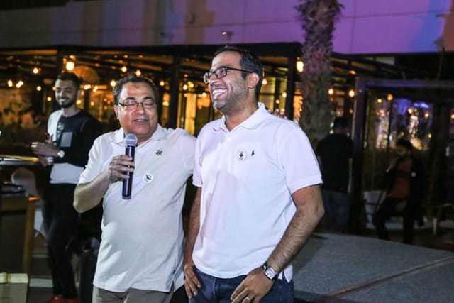 A photo of two men at an event