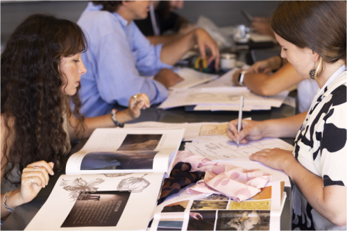 Several people watching albums